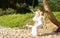 Happy family at beach. mother shook child on swing in summer