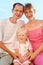 Happy family on beach, Parents hold girl for hands