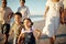 Happy family, beach vacation and children running during fun active activity in summer with parents and grandparents