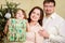 happy family with box of gift by Christmas tree. tradition giving gifts