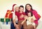 Happy family with box gift, woman with child and elderly - holiday concept
