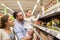 Happy family buying food at grocery store