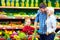 Happy family buying healthy food in supermarket