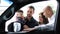 Happy family buys a car on credit. Young couple chooses a new car with her husband and children