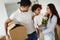 Happy family with cardboard boxes