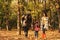 Happy family with child spending time together. Autumn walk