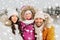 Happy family with child in winter clothes outdoors