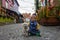 Happy family, children and adults, enjoying the colorful city of Stavangen in Southwest Norway in summer