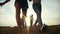 Happy family children kids together run are jumping in the park at sunset silhouette. people in the park concept mom dad