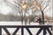 Happy family with children playing snowballs outdoors in nature, enjoying winter and snowy weather