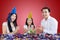 Happy family clapping in a birthday party