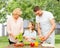 Happy family cooking vegetable salad for dinner