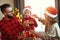 Happy family decorate Christmas tree, parents play with child son with garlands