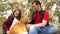 Happy family with a dog and children in a camping trip. Carefree teenagers with their father on a day off. Hiking