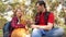 Happy family with a dog and children in a camping trip. Carefree teenagers with their father on a day off. Hiking