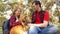 Happy family with a dog and children in a camping trip. Carefree teenagers with their father on a day off. Hiking