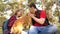 Happy family with a dog and children in a camping trip. Carefree teenagers with their father on a day off. Hiking