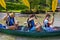Happy family doing canoe in lake bohinj, slovenia