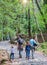 Happy family are doing hiking in the forest