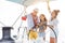 Happy family doing luxury sailboat trip - Father, mother and daughter doing selfie photo while having fun traveling in caribbean