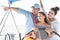 Happy family doing sail boat trip - Father, mother and daughter having fun traveling in caribbean sea - Travel, love and