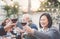 Happy family eating and drinking red wine at dinner barbecue party outdoor - Mature and young people dining together on terrace