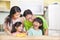 Happy family eating fruits in the kitchen