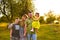 Happy family enjoying in park. Cute Portrait of Happy Family. Parents with preschool son and little daughter. Lifestyle family