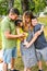 Happy family enjoying in park. Cute Portrait of Happy Family. Parents with preschool son and little daughter. Lifestyle family