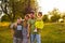 Happy family enjoying in park. Cute Portrait of Happy Family. Parents with preschool son and little daughter. Lifestyle family