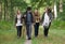 Happy family enjoying a stroll through the woods