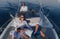 A happy family enjoys a vacation together while riding a luxury boat at sea. Selective focus