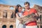 Happy family in Europe. Romantic couple in Rome over Coliseum background