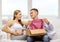 Happy family expecting child opening parcel box