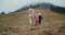 Happy family explore earth on springtime journey and mountain hike on road trip