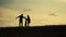 Happy family father, mother and son outdoors silhouette concept slow motion video. Dad man mom girl hold little boy son