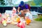 Happy family feeding colorful pigeon birds on farm