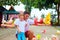 Happy family feeding colorful pigeons on animal farm