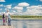 Happy family on fishing - father, son and daughter with fishing