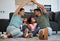 Happy family, floor and hands roof for safety, support and care or affection in home. Love, protection or house