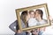 Happy family framed by a picture frame