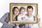 Happy family framed by a picture frame