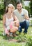 Happy family in garden with horticultural sundry