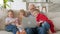 Happy family generations, an elderly gray-haired grandfather with two grandchildren and granddaughter, wave greeting