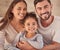 Happy family, girl and an interracial couple smiling and excited about spending quality time together. Portrait of