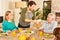 Happy family with grandfather having dinner