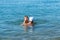 Happy family. Grandfather and smiling grandson playing at the sea. Positive human emotions, feelings,