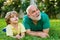 Happy family Grandson hugs his grandpa on holiday. Two generation - weekend together. Grandson embrace his grandfather