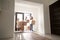 Happy family in hallway with cardboard boxes