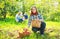 Happy family with harvested apples